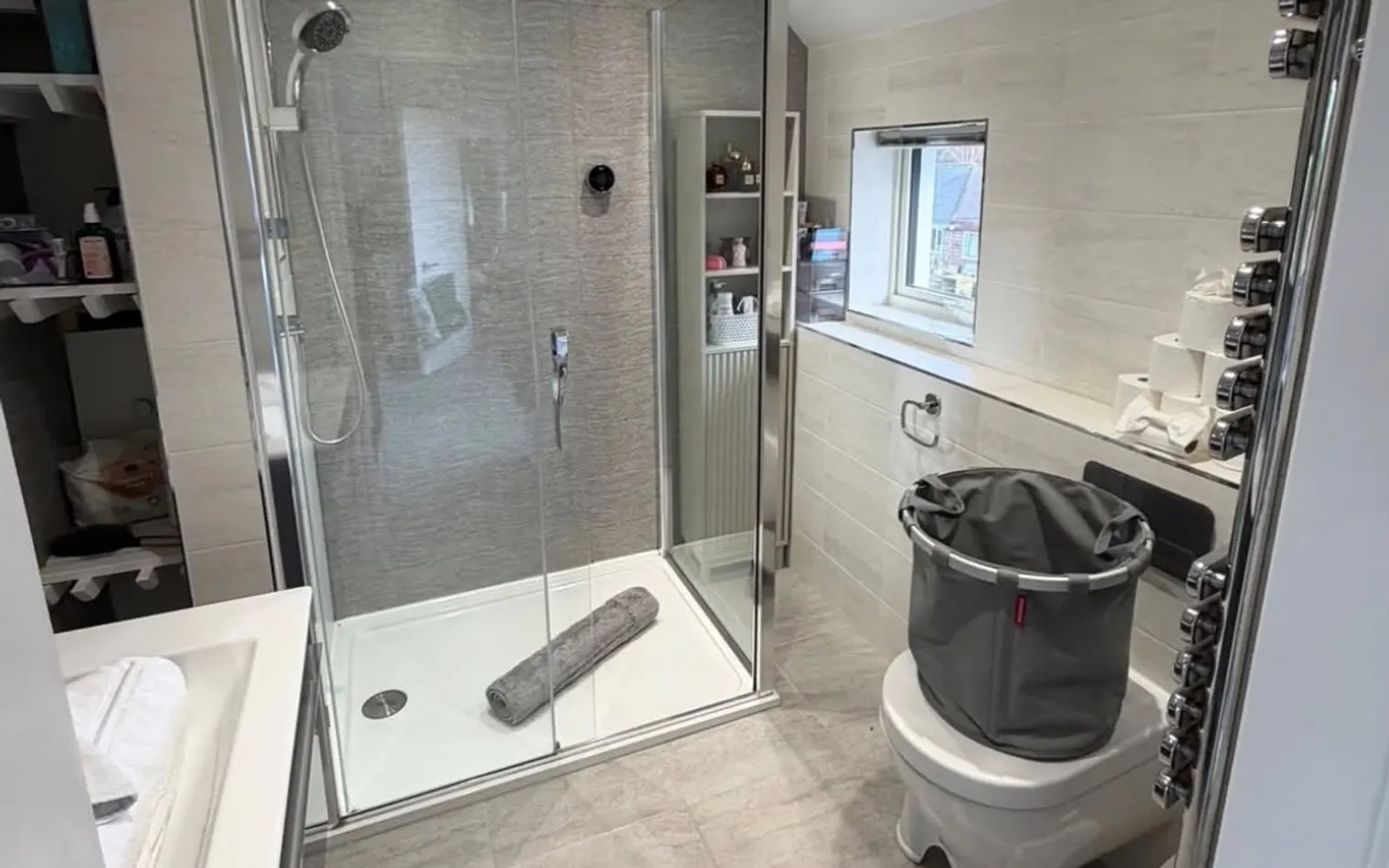 The same bathroom after the clean, with the shower tray and floor clear